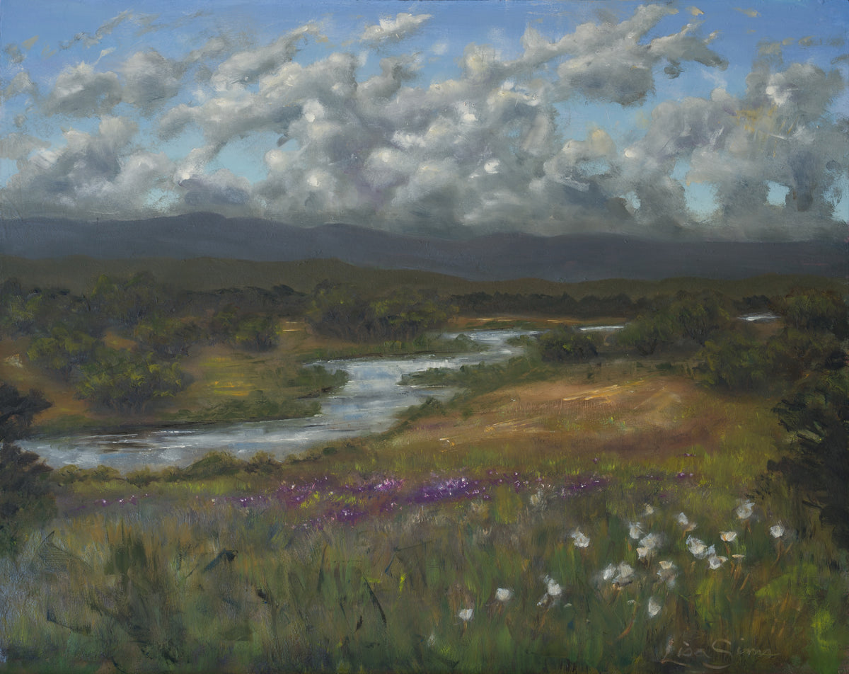 Oil painting of a winding river through grass and wildflowers with distant hills and clouds in the sky.